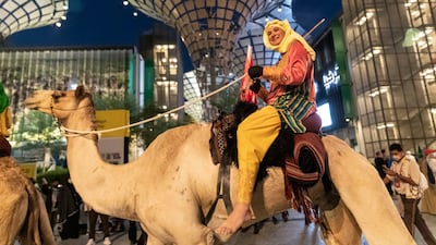 A camel trekker smiles on completing the journey.