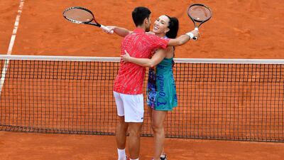 Novak Djokovic hugs Jelena Jankovic during a tennis doubles against Serbia's Nenad Zimonjic and Olga Danilovic at a charity exhibition hosted by Novak Djokovic, in Belgrade. AFP
