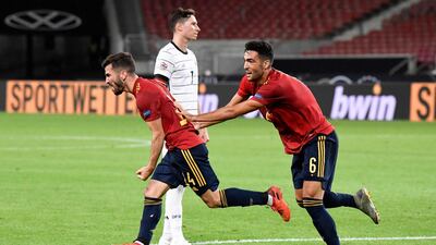 Spain defender Jose Luis Gaya Pena celebrates with Mikel Merino after scoring the equaliser against Germany. AFP