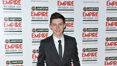 Tom Holland, in a grey wool suit, arrives at the Jameson Empire Awards at Grosvenor House on March 24, 2013 in London. Getty Images