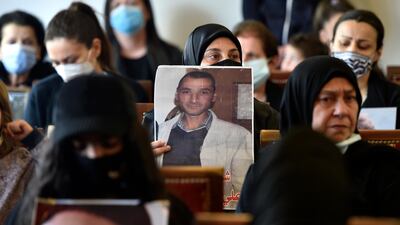 Families of victims of the Beirut port explosion carry pictures of the victims, during the ceremony on the occasion of Mother's Day in Beirut, Lebanon. EPA