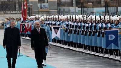 Turkish President Recep Tayyip Erdogan, left, and Iraqi President Barham Salih, right, walk past a guard of honour during an official welcoming ceremony at the Presidential Complex in Ankara. AFP