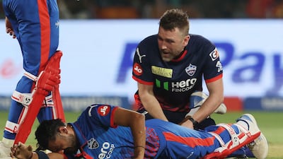 Delhi Capitals' Axar Patel receives medical attention before retiring hurt after scoring 26. Reuters