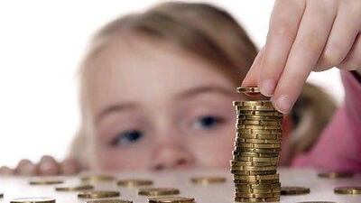 According to studies, children as young as 5 are already able to grasp the basics of money and that it is needed to buy things. istockphoto.com