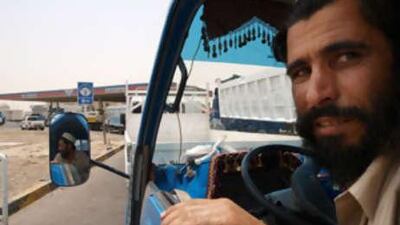 A driver sits in his vehicle while waiting to fill-up with diesel at an Adnoc station in Musaffah.