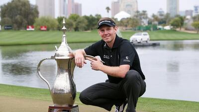 Stephen Gallacher is having trouble finding space for his trophies after winning the past two Dubai Desert Classic titles. He covets a third coffee pot trophy, nonetheless. Pawan Singh / The National