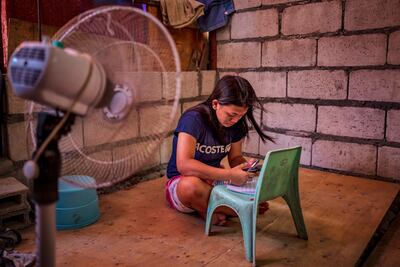 A pupil completes learning modules at home after her school shut amid extreme heat in Tondo district in Manila, Philippines. Getty Images