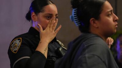 New York Police officers outside NewYork-Presbyterian Weil Cornell Medical Centre. Officer Islam was described as 'a hero'. AP