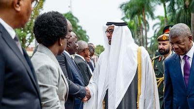 Sheikh Mohamed is greeted by senior Angolan officials, before holding talks with Mr Lourenco