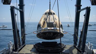 The SpaceX Crew Dragon Endeavour spacecraft is lifted onto the SpaceX GO Navigator recovery ship shortly after it landed. REUTERS