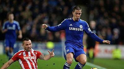 Stoke City's Phil Bardsley, left, challenges Chelsea's Eden Hazard during their English Premier League match at the Britannia Stadium in Stoke, Britain, 22 December 2014. EPA/NIGEL RODDIS