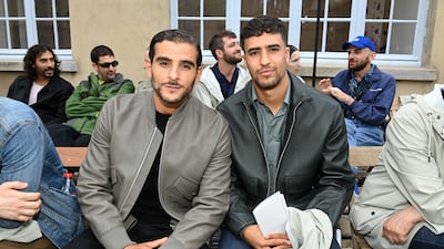 French-Algerian rapper Sofiane Zermani and actor Shain Boumedine attend the Hermes menswear spring/summer 2023 show as part of Paris Fashion Week, on June 25, 2022. Getty Images