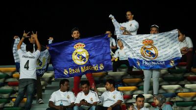 Local fans cheer for Real Madrid during the semi-final of the Club World Cup in Abu Dhabi between the Spanish club and the Kashima Antlers. Andrew Boyers / Reuters