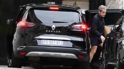 Nicolas Sarkozy arriving at his home after a Paris court granted him early release from jail, pending an appeal. AFP