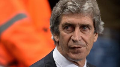 Manuel Pellegrini and Manchester City face a 2-0 deficit for the second leg in Barcelona. Peter Powell / EPA