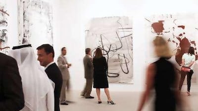 Dignitaries at the opening of the RSTW Exhibit from the private collection of Larry Gagosian at Manarat al Saadiyat. Works by Rauschenberg, Ruscha, Serra, Twombly, Warhol and Wool are on display.