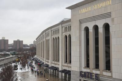 People line up outside a Covid-19 vaccination hub inside Yankee Stadium in the Bronx borough of New York City on Friday, February 5, 2021. Bloomberg