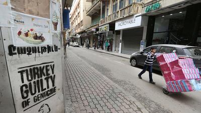 Graffiti in the Armenian neighbourhood of Burj Hammoud, north of Beirut, shows the legacy of Turkish persecution. For many Syrian-Armenian refugees in Lebanon, the murder and exile of their ancestors a century ago is not just a historical event but an ongoing trauma. Joseph Eid / AFP
