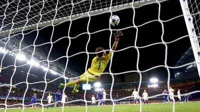 Willian of Chelsea, unseen, scores a free kick past Oleksandr Shovkovskiy of Dynamo Kiev for the 2-1 winner on Wednesday night in the Champions League. Clive Rose / Getty Images