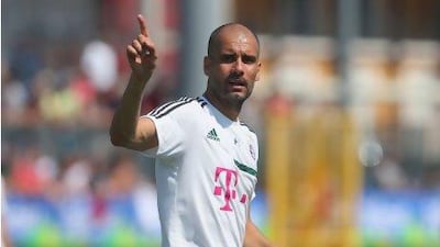 Bayern Munich coach Pep Guardiola gestures during a training session this week. Alexander Hassenstein / Getty Images