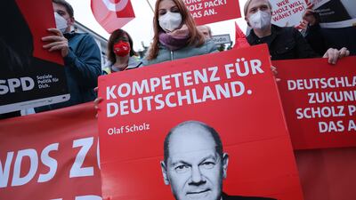 Supporters of SDP candidate Olaf Scholz wait for his arrival before a final televised election debate. Photo: Getty