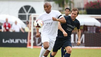Quinton Fortune of Team YR1M and Gaizka Mendieta of Team Laureus battle for the ball during the Laureus All Stars Unity Cup on Tuesday. Ian Walton / Getty Images / March 25, 2014