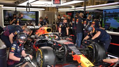 Red Bull's Max Verstappen sits in his car at the team's garage in pit lane at Interlagos racetrack. AFP