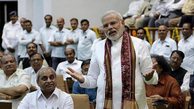 Indian Prime Minister-Elect, Narendra Modi (R) addresses a special farewell session of Gujarat Assembly in Gandhinagar. AFP Photo