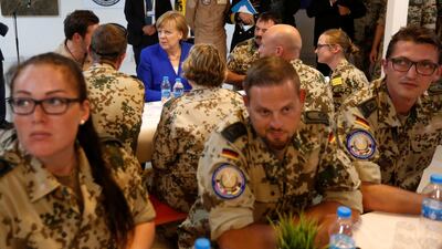 German chancellor Angela Merkel talks with German soldiers stationed in Jordan, June 21, 2018. REUTERS/Muhammad Hamed