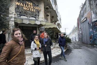 The Walled-Off hotel is hemmed in by an eight-metre-high concrete wall built by Israel. Heidi Levine / The National