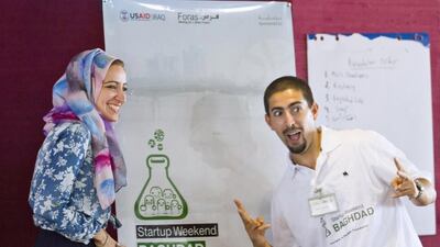 Coaches Katral Nada-Hassan, left, and Othmane Rahmouni during a Start-up Weekend session in Baghdad. Ghaith Salih / Metrography for The National