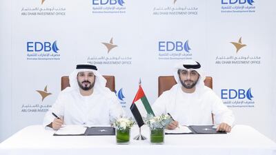 Emirates Development Bank and Abu Dhabi Investment Office representatives during the signing ceremony. Photo: EDB and Adio