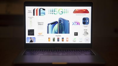 Features of the Apple iPhone 12 and iPhone 12 mini are displayed during a virtual product launch seen on a laptop computer in Tiskilwa, Illinois, US., Bloomberg