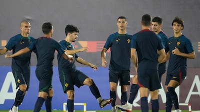 Portugal's Cristiano Ronaldo, centre, warms up with Portugal teammates. AP