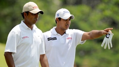 Anirban Lahiri, left, will cut his honeymoon short after receiving a surprise invitation to play the British Open, which starts Thursday. Khalid Redza / AFP