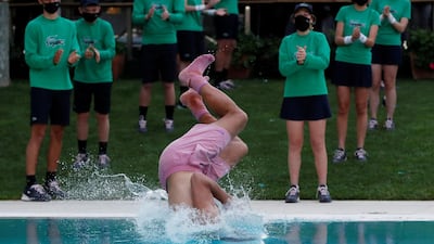 Spain's Rafael Nadal celebrates with the traditional pool dive after beating Stefanos Tsitsipas to win the Barcelona Open on Sunday, April 25. Reuters