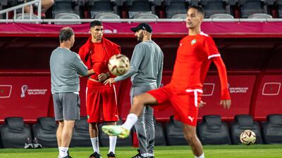 Morocco coach Walid Regragui gives instructions to Achraf Hakimi. EPA