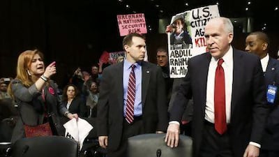 Protesters disrupt proceedings as John Brennan arrives to testify before a Senate Intelligence Committee hearing on his nomination to be the director of the CIA.