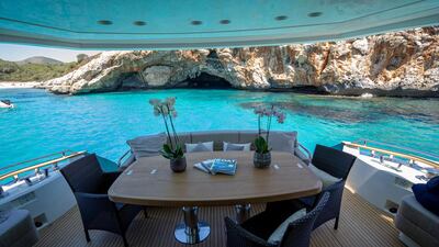 Al fresco dining can be enjoyed on the cockpit deck. Courtesy Camper & Nicholsons