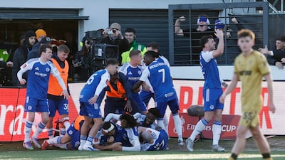 Paul Dawson celebrates scoring Macclesfield's first goal with teammates. Reuters