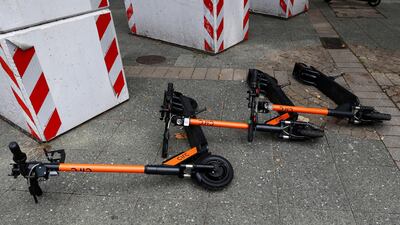 E-scooters lay on the ground in Frankfurt, Germany. Cobbled streets are proving a challenge for e-scooter firms. Reuters