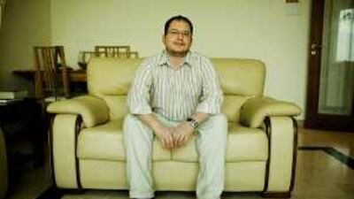 Andrew Bond, 30, is hoping to save enough money to pay off his mortgage in the UK by 2012.