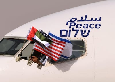 On August 31, 2020, an Israel El Al plane, adorned with the word peace in Arabic, English and Hebrew, arrives at Abu Dhabi International Airport. AFP