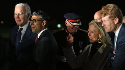 Mr Biden, Mr Sunak and Ms Hartley at the airport. AFP