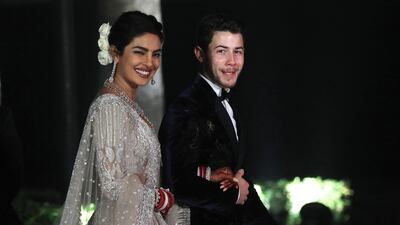Newlyweds Priyanka Chopra, 36, and Nick Jonas, 26, pose for a photograph during a reception at a hotel in New Delhi on December 4, 2018. Photo: EPA