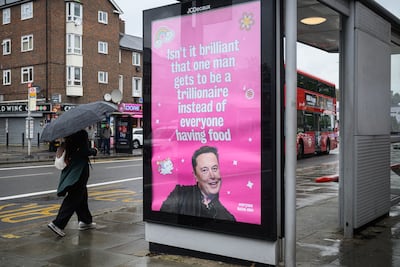A poster in the UK criticises Elon Musk's growing wealth. Getty Images