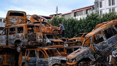 Charred vehicles are piled high near the torched Parliament building in Nepal's capital Kathmandu. AFP