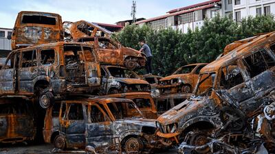 Charred vehicles stacked inside the Parliament building complex in Kathmandu, which was set on fire during protests in September. AFP