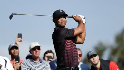 Tiger Woods hit a 72 in his first round at Torrey Pines on Thursday. Gregory Bull / AP Photo