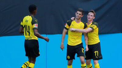 Borussia Dortmund's Christian Pulisic celebrates scoring a goal with team mates. Reuters
